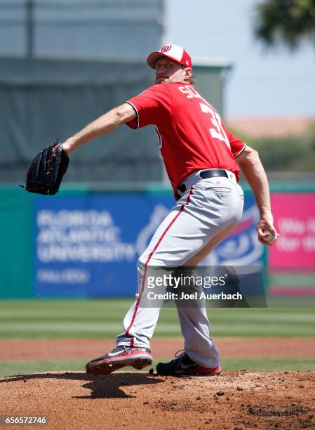 Max Scherzer of the Washington Nationals pitches against the St Louis Cardinals in the first inning during a spring training game at Roger Dean...