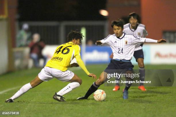 Elvis Lima Sousa of F91 and Takefusa Kubo of Japan fight for the ball during a friendly soccer match between F91 Diddeleng and the Japan U20 team at...