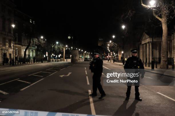 Armed police officers seen around Westminster after a terrorist attack in London on March 22, 2017. Four people including a police officer and his...