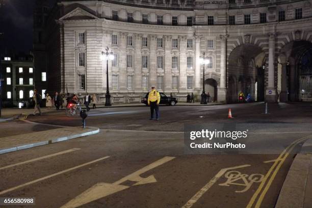 Armed police officers seen around Westminster after a terrorist attack in London on March 22, 2017. Four people including a police officer and his...