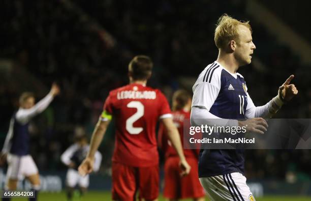 Steven Naismith of Scotland celebrates after he scores during the International Challenge Match between Scotland and Canada at Easter Road on March...