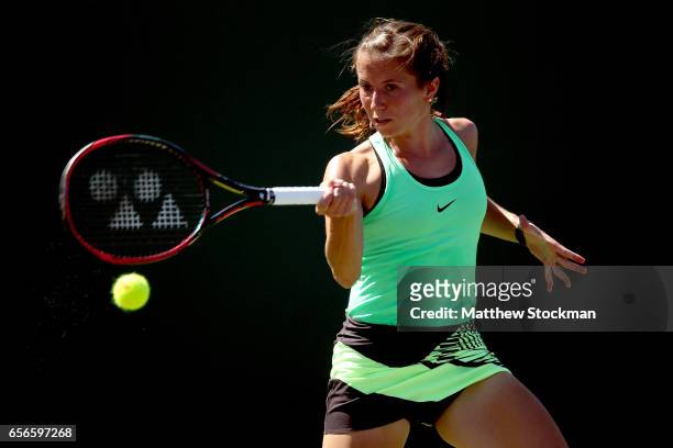 Annika Beck of Germany returns a shot to Christina McHale during the Miami Open at the Crandon Park Tennis Center on March 22, 2017 in Key Biscayne,...