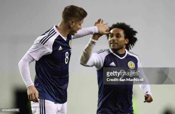 Tom Cairney and Ikechi Anya of Scotland celebrates scotlands' only goal during the International Challenge Match between Scotland and Canada at...