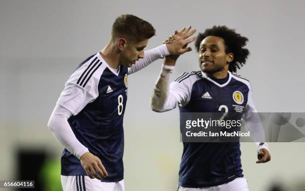 Tom Cairney and Ikechi Anya of Scotland celebrates scotlands' only goal during the International Challenge Match between Scotland and Canada at...