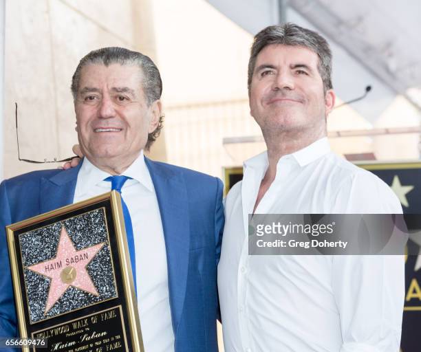 Haim Saban and Simon Cowell pose for a picture as Haim Saban is honored with a star on The Hollywood Walk of Fame on March 22, 2017 in Hollywood,...