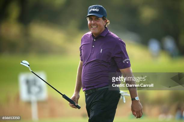 Phil Mickelson reacts after putting on the 15th hole of his match during round one of the World Golf Championships-Dell Technologies Match Play at...