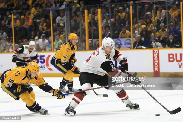 Nashville Predators right wing Viktor Arvidsson challenges Arizona Coyotes defenseman Connor Murphy for the puck during the NHL game between the...