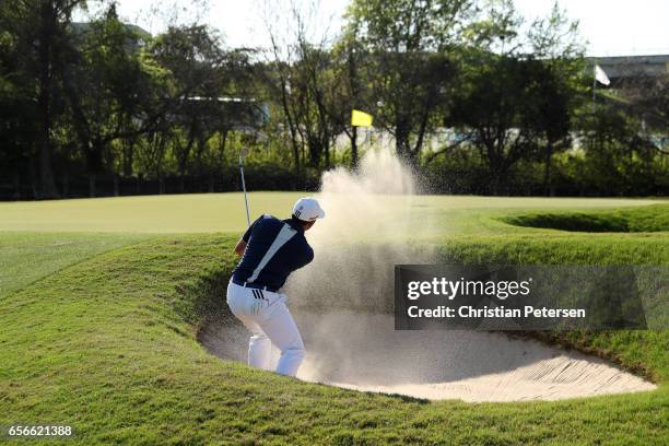 Sergio Garcia of Spain plays a shot from a bunker on the 12th hole of his match during round one of the World Golf Championships-Dell Technologies...