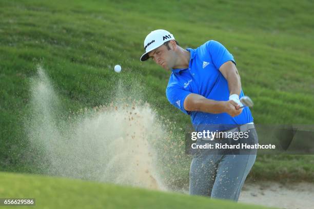 Jon Rahm of Spain plays a shot out of a bunker on the 16th hole of his match during round one of the World Golf Championships-Dell Technologies Match...