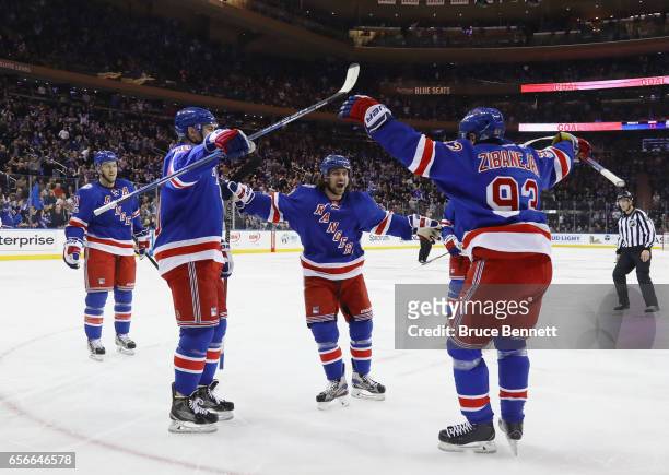The New York Rangers celebrate a powerplay goal by Mats Zuccarello at 2:36 of the second period against the New York Islanders at Madison Square...