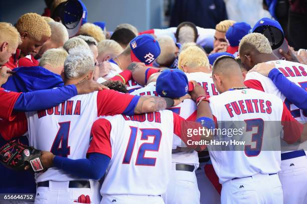 Team Puerto Rico huddles in the dugout before playing against team United States during Game 3 of the Championship Round of the 2017 World Baseball...