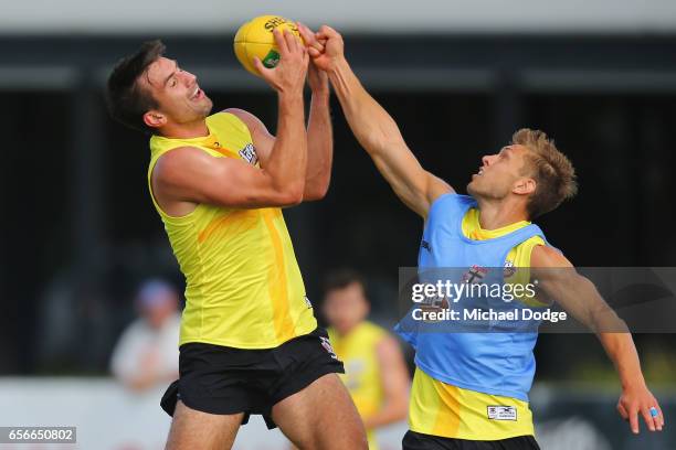 Billy Longer of the Saints marks the ball against Sean Dempster of the Saints during a St Kilda Saints AFL training session at Linen House Oval on...