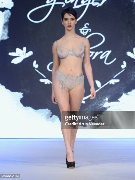 Model walks the runway wearing Ginger & Flora at Vancouver Fashion Week Fall/Winter 2017 at Chinese Cultural Centre of Greater Vancouver on March 22,...