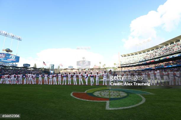 Team Puerto Rico players and coaches stand on the field for introductions before Game 3 of the Championship Round of the 2017 World Baseball Classic...