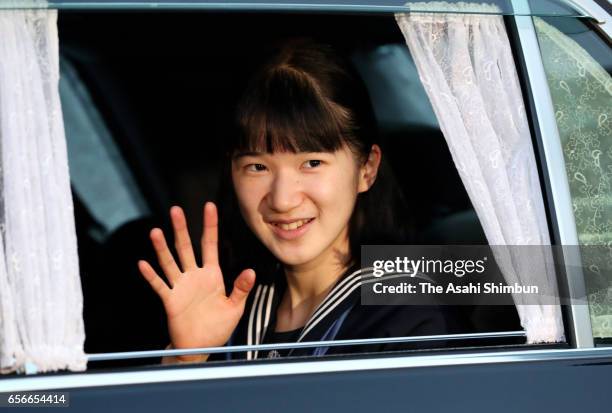 Princess Aiko waves to media reporters on arrival at the Imperial Palace to meet Emperor and Empress after graduating her junior high school on March...