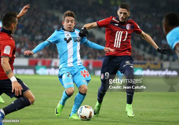 Maxime Lopez of OM and Yassine Benzia of Lille in action during the French Ligue 1 match between Lille OSC and Olympique de Marseille at Stade...