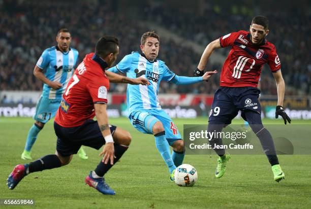 Maxime Lopez of OM in action between Rony Lopes and Yassine Benzia of Lille during the French Ligue 1 match between Lille OSC and Olympique de...