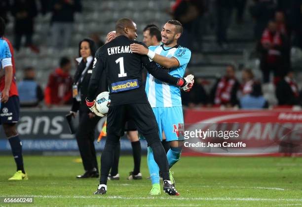 Dimitri Payet of OM greets goalkeeper of Lille Vincent Enyeama following the French Ligue 1 match between Lille OSC and Olympique de Marseille at...