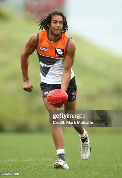 Tendai M'Zungu handballs during the Greater Western Sydney Giants AFL training session at WestConnex Centre on March 23, 2017 in Sydney, Australia.