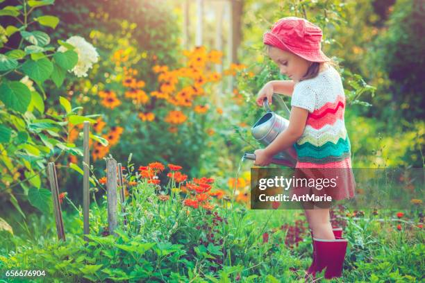 happy little girl in garden - beautiful russian girls stock pictures, royalty-free photos & images