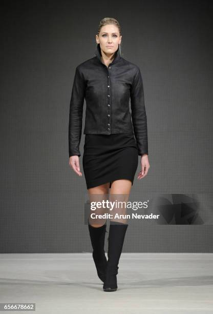 Model walks the runway wearing Tristen Mickelson at Vancouver Fashion Week Fall/Winter 2017 at Chinese Cultural Centre of Greater Vancouver on March...