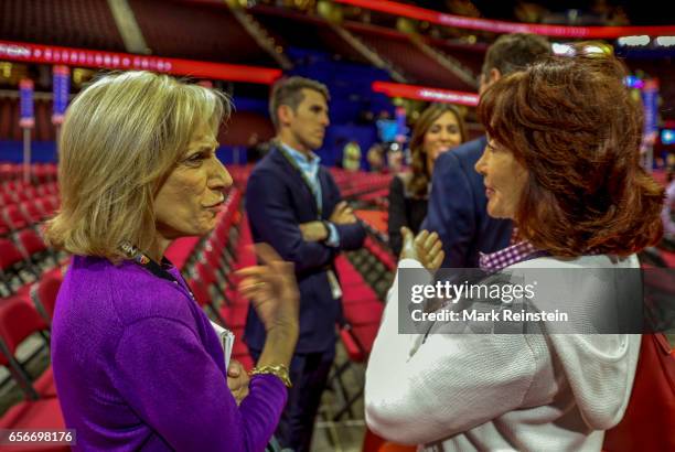 In the Quicken Arena before the Republican National Convention, American broadcast journalist Andrea Mitchell of NBC TV speaks with Kathleen Manafort...