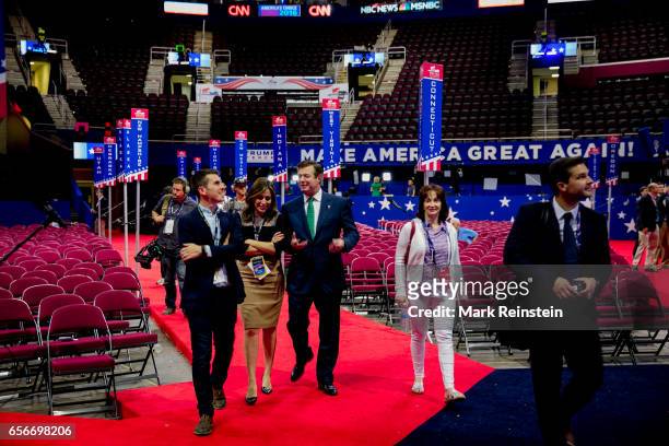 On the floor of the Quicken Arena before the Republican National Convention, American broadcast journalist Hallie Jackson of NBC-TV walks with...