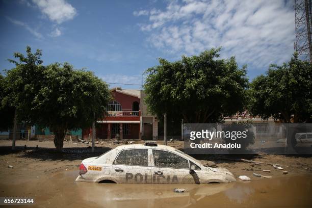 Sunken police car is seen in a muddy area after a sudden flood in city of Huarmey, 300 kilometers north of Lima, Peru on March 22, 2017. The climate...