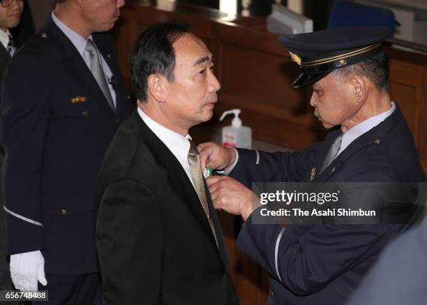 Head director of school operator 'Moritomo Gakuen' Yasunori Kagoike arrives prior to an upper house budget committee at the diet building on March...