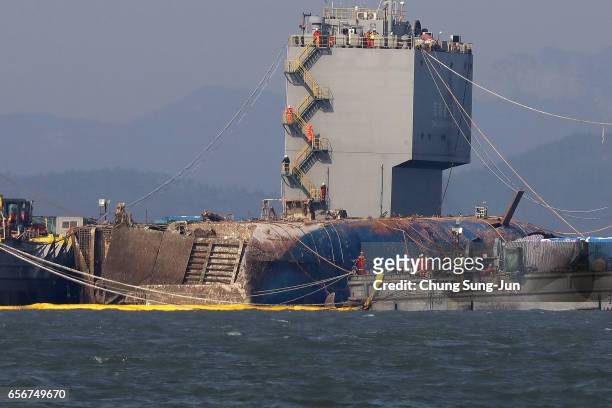Submersible vessel attempts to salvage sunken Sewol ferry in waters off Jindo, on March 23, 2017 in Jindo-gun, South Korea. The Sewol sank off the...