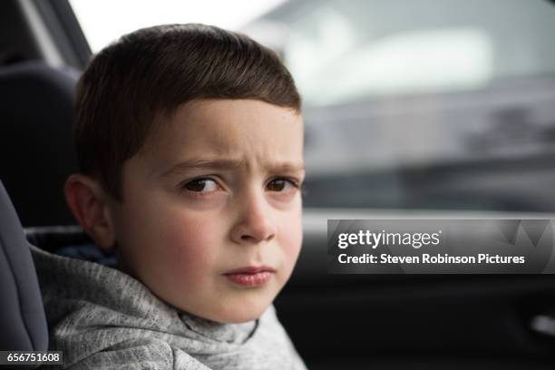 boy in car - displeased stock pictures, royalty-free photos & images