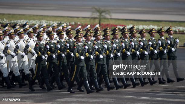 Chinese troops march during a Pakistan Day military parade in Islamabad on March 23, 2017. Pakistan National Day commemorates the passing of the...