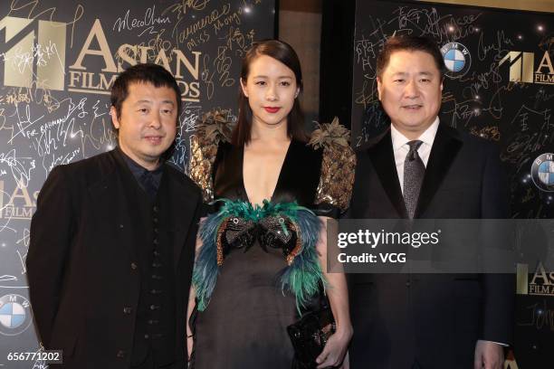 Director Jia Zhangke, actress Karena Lam and Polybona Films CEO Yu Dong arrive at the red carpet of the 11th Asian Film Awards at Hong Kong Cultural...