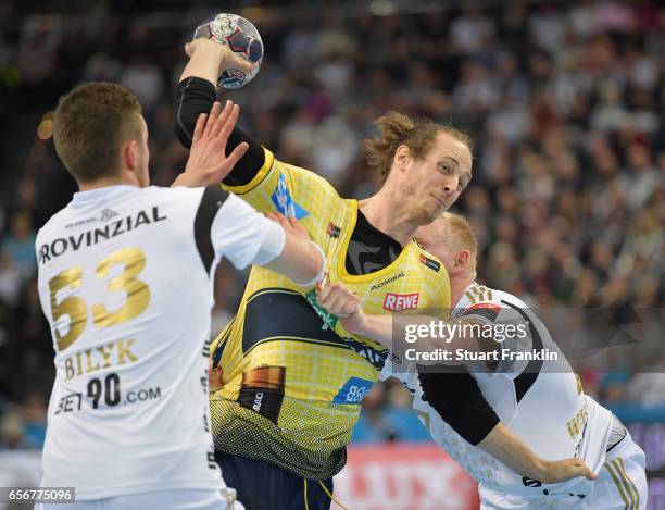 Nikola Bilyk of Kiel challenges Kim Ekdahl Du Rietz of Rhein Neckar during the first leg round of 16 EHF Champions League match between THW Kiel and...