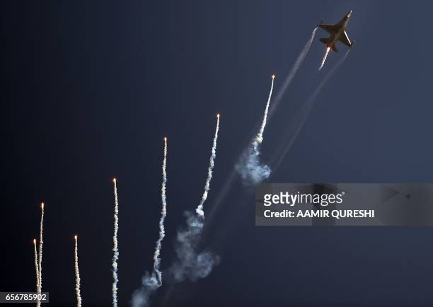 Pakistani F-16 fighter jets flies past during a Pakistan Day military parade in Islamabad on March 23, 2017. Pakistan National Day commemorates the...