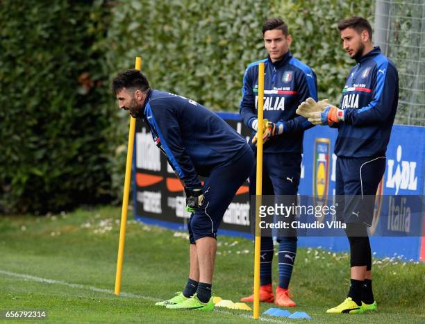 Gianluigi Buffon, Alex Meret and Gianluigi Donnarumma of Italy look on during the training session at the club's training ground at Coverciano on...