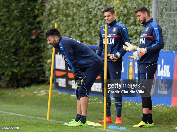 Gianluigi Buffon, Alex Meret and Gianluigi Donnarumma of Italy look on during the training session at the club's training ground at Coverciano on...