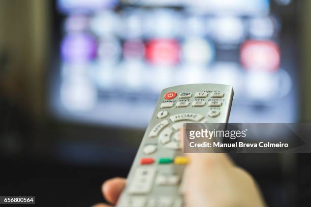 remote control and smart tv - advertisement stock-fotos und bilder