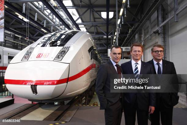 Richard Lutz Chairman of the DB Deutsche Bahn or german Railways Poses between two members of the board Berthold Huber, L, and Ronand Pofalla in...