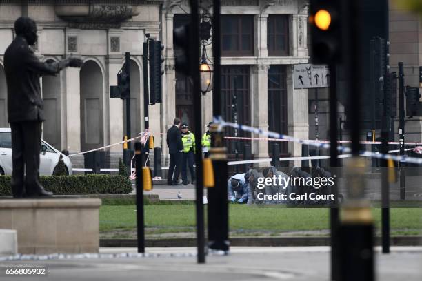 Police forensic officers work in Parliament Square following yesterday's attack, on March 23, 2017 in London, England. Four people including the...