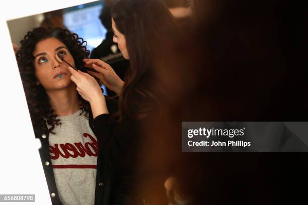 Model being styled backstage ahead of the New Gen show during Mercedes-Benz Istanbul Fashion Week March 2017 at Grand Pera on March 23, 2017 in...