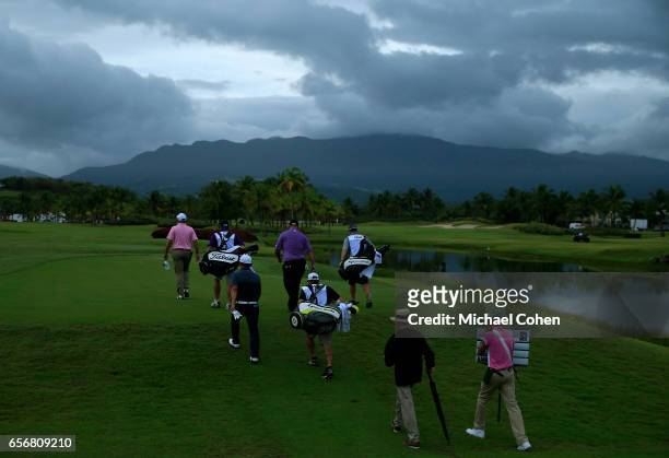 Dicky Pride, Sung Kang, and Brendon de Jonge of Zimbabwe walk the first hole during the first round of the Puerto Rico Open at Coco Beach on March...
