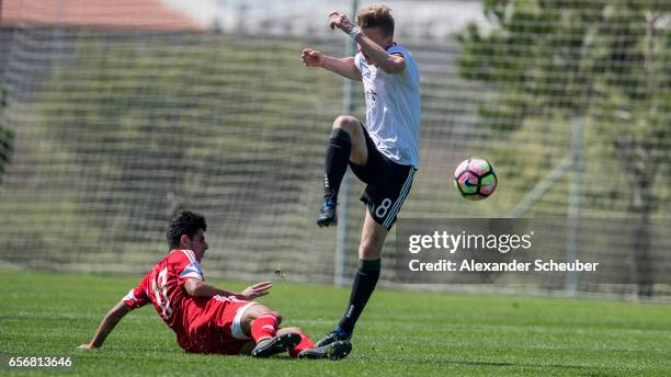 Aram Khamoyan of Armenia challenges Erik Majetschak of Germany during the UEFA U17 elite round match between Germany and Armenia on March 23, 2017 in...