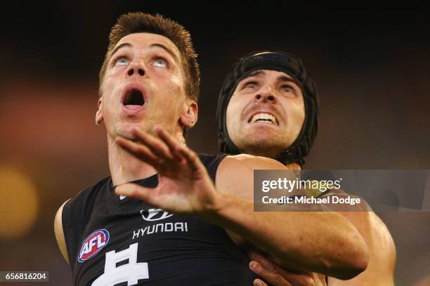 Matthew Kreuzer of the Blues competes for the ball against Ben Griffiths of the Tigers during the round one AFL match between the Carlton Blues and...