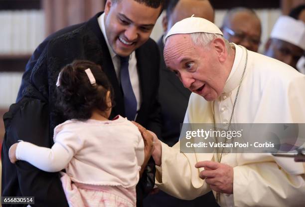 Pope Francis Meets a child as President of Cameroon Paul Biya and wife Chantal visit him on March 23, 2017 in Vatican City, Vatican.