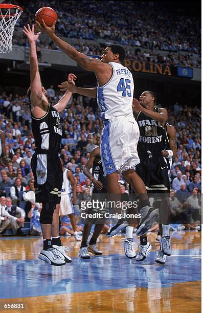 Julius Peppers of the North Carolina Tar Heels jumps for a layup during the game against the Wake Forest Demon Deacons at the Dean E. Smith Center in...