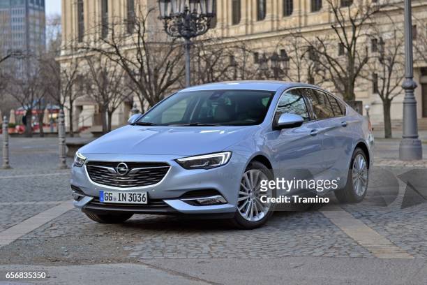 opel insignia grand sport stopped on the street - opel stock pictures, royalty-free photos & images
