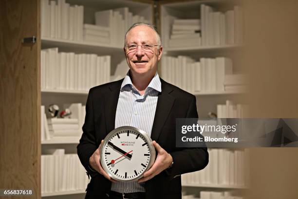 Andre Bernheim, chief executive officer of Mondaine Watch Ltd., poses for a photograph following an interview at the company's booth during the 2017...