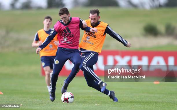 Andy Robertson vies with Steven Fletcher during a training session at Mar Hall on March 23, 2017 in Erskine, Scotland.