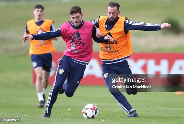 Andy Robertson vies with Steven Fletcher during a training session at Mar Hall on March 23, 2017 in Erskine, Scotland.